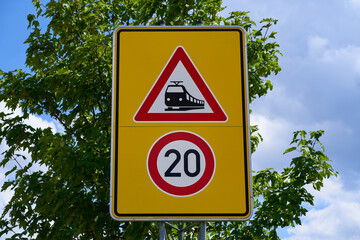 The traffic sign means unrestricted train crossing. The speed limit is 20. Beware of the...