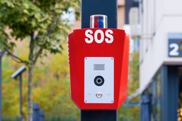 SOS, police, emergency button in a public park.