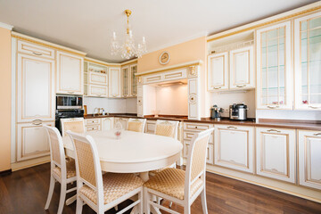 The interior of a large and spacious kitchen-living room in a classic style. 