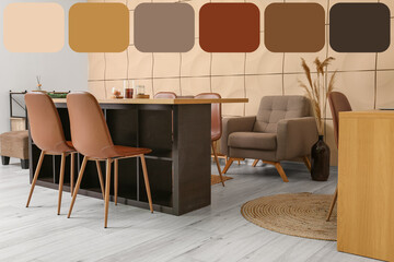 Stylish table with brown chairs in light dining room. Different color patterns