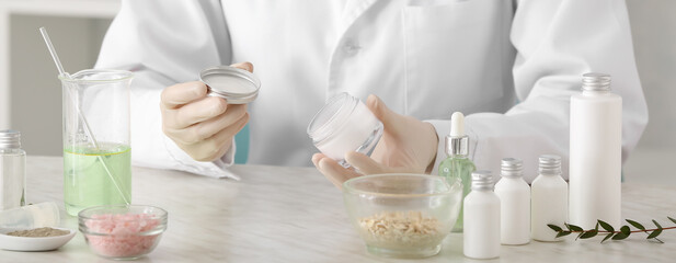 Beautician preparing natural cosmetics in laboratory