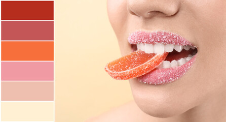 Beautiful young woman with creative makeup and marmalade in mouth on light background, closeup....