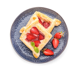Plate with strawberry puff pastries and mint leaves on white background