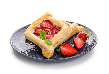 Plate with strawberry puff pastries and mint leaves on white background