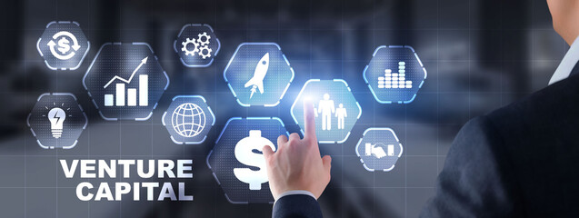 Businessman select VENTURE CAPITAL on virtual screen