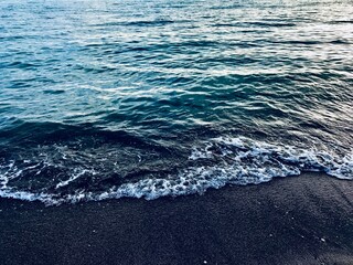 Beautiful wave texture on the seashore. Watercolour, multicolour textured background. Exotic island seaside banner. Sea waves with a lot of sea foam. Natural background for concept summer vacation. Na