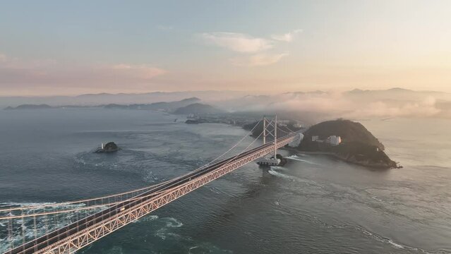 Flyover Naruto suspension bridge and strong ocean current at sunset