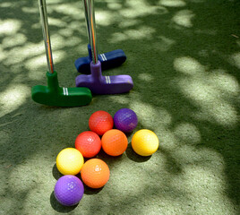 Mini golf clubs and balls