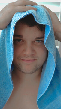 Blue-eyed Boy Drying Off with a Blue Towel