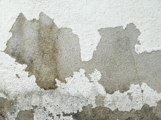 old white concrete wall with rough and crack texture.