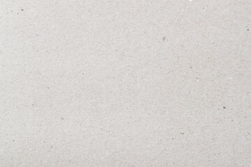 Texture of organic light grey paper, background for design. Recyclable material, has inclusions of...