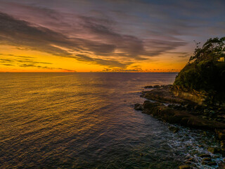 Sunrise over the sea with high cloud