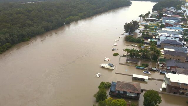 Aerial drone view of major flooding along Georges River at East Hills in South West Sydney, NSW, Australia during severe rainfall weather in July 2022 