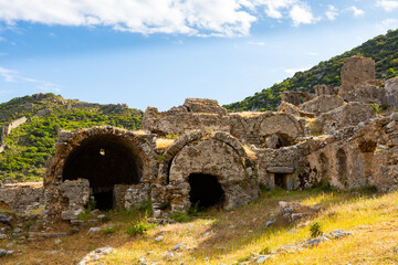Fototapeta na wymiar Ruins of ancient city Anemurium, necropolis. Very interesting historical place in Anamur, Mersin, Turkey
