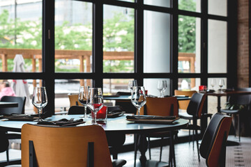 Empty tables set at restaurant ready for guests