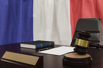 Law and justice concept,  gavel on a wooden desktop and the France flag on background. 3d render.