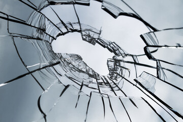 Texture of broken glass for background. Broken window. Close up.