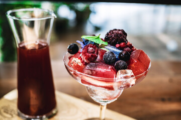 glass of fruit juice with berries