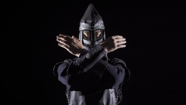 Mongolian Soldier in Antiquity. Black background.
Mongolian soldier looking at camera. Historical reenactment.
