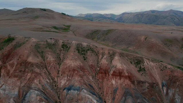 Kyzyl-Chin valley with red mountains also called as Mars valley in Altai, Siberia, Russia. Beautiful summer nature landscape at during daytime. Aerial view from a drone