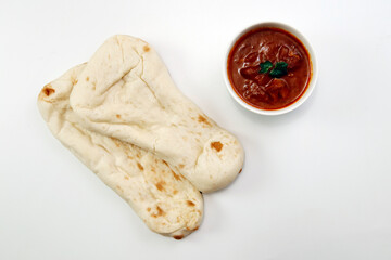 Nan made from wheat to eat with Indian curry on the table