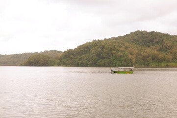 boat on the lake boat on the river or perahu di waduk sermo, yogyakarta, indonesia