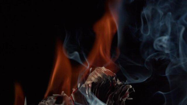 Burning American hundred dollar banknotes, Flame of fire from money. Rich person having stacks of 100 US dollars in metallic suitcase. Paper money loss, financial crisis and depressed economy. 