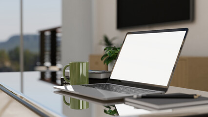 Modern portable workplace with portable notebook laptop on coffee table in home living room