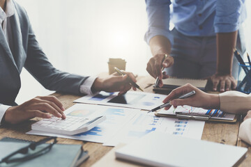 Meeting concept Business team hands at working with financial plan, meeting, discussion, brainstorm with tablet on the office desk, business financial concept.