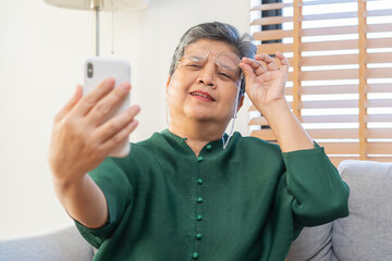 Presbyopia, Hyperopia mature asian woman holding eyeglasses having problem with vision problem...