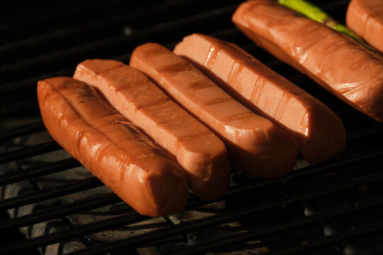 Veggie dog wieners on a barbecue grill