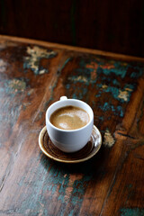 Cup of coffee on rustic wooden background. Copy space.                                                                                                                          