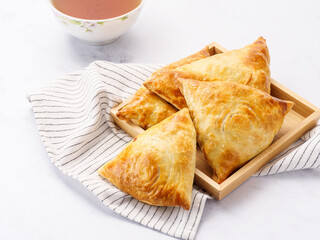 Samosa, samsa meat stuffed pies, oriental style. Uzbek national dish samosaSamosa, samsa meat stuffed pies, oriental style. Uzbek national dish samosa