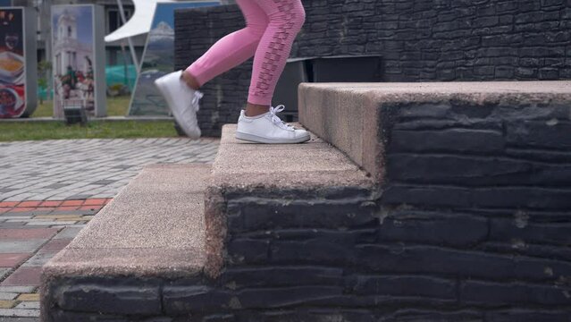 Woman climbing stairs. Daily routine