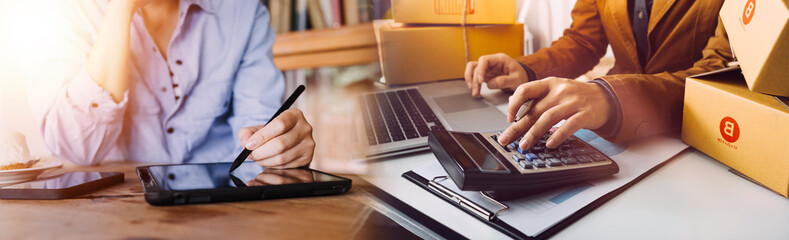 Business woman start up small business entrepreneur SME success .freelance woman working at home with Online Parcel delivery. SME and packaging deliveryconcept