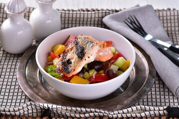 Summer vegetable salad with grilled salmon