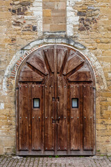 Fototapeta na wymiar Wooden entrance gate to the Iglesia San Miguel de Lillo, Oviedo, Asturias, Spain.