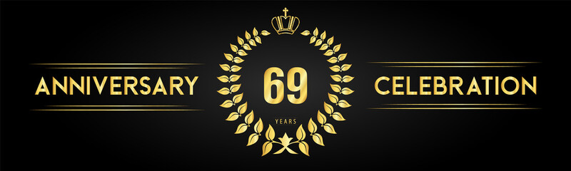Fototapeta premium 69 years anniversary celebration logo with laurel wreath and royal crown isolated on black background. Premium design for happy birthday, wedding, celebration events, greetings card, graduation.