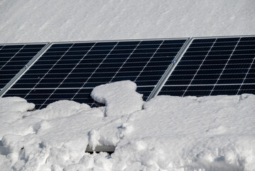 Solar panels under snow in winter.