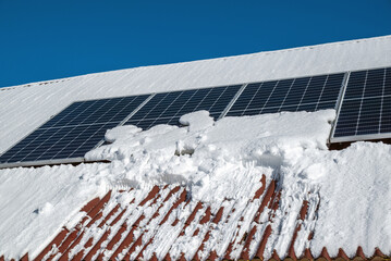 Solar panels under snow in winter.