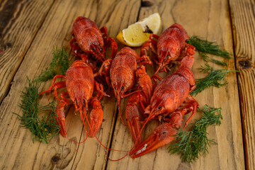 large boiled crayfish on a wooden board