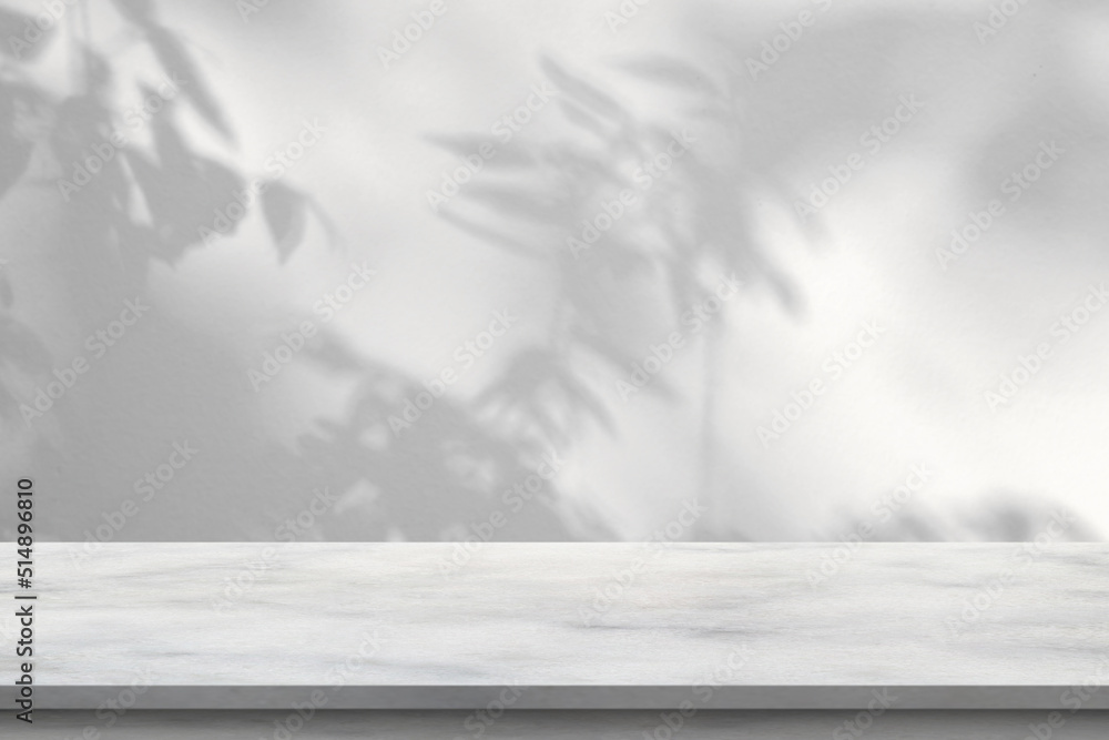 Wall mural marble table with tree shadow drop on white wall background for mockup product display