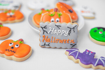 Happy Halloween with funny Cookies; Pumpkin, scary ghost, spooky mummy, bat, frankenstein, dracula...