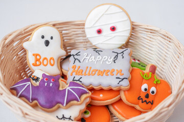 Halloween funny Cookies in wooden basket. Trick or Threat, Happy Halloween, Hello October, fall autumn, Festive, party and holiday concept