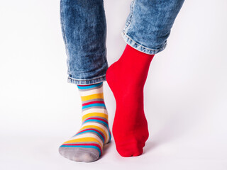 Men's legs and bright socks. Without shoes. Closeup. Style, beauty and elegance concept