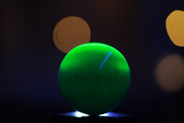 Background with glowing ball and bokeh. Ball for predictions. Clairvoyant ball.