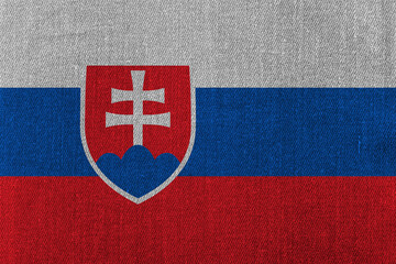 Patriotic classic denim background in colors of national flag. Slovakia