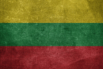 Old leather shabby background in colors of national flag. Lithuania