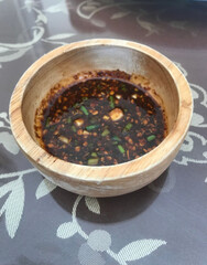 Spicy sauce for grilled meat made from chili powder and fish sauce in Thai food,Include Clipping Path.