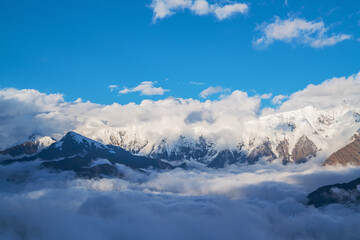 The natural beauty of Gongga snow mountain and blue sky and white clouds in Western Sichuan, China